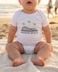 Baby wearing Mission Beach Rollercoaster bodysuit at Mission Beach in San Diego