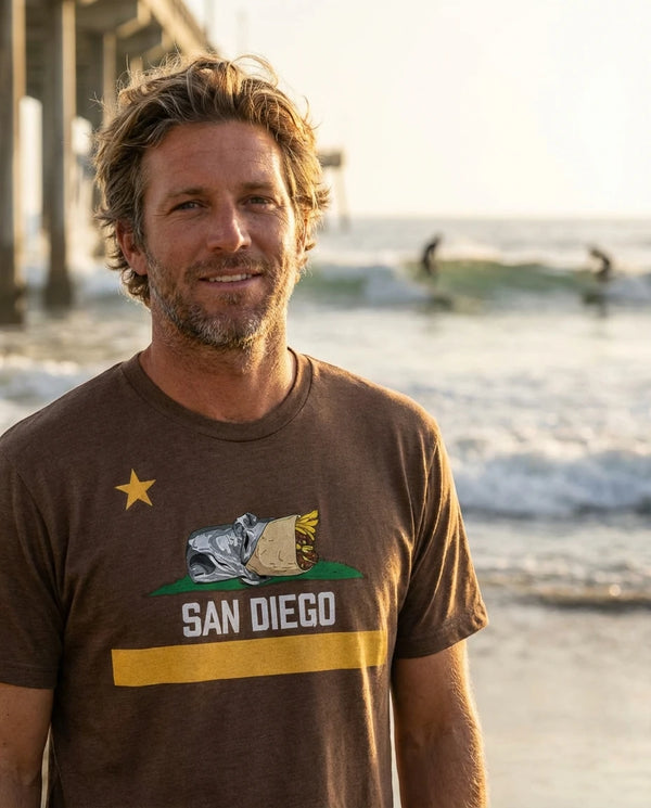Person wearing San Diego Burrito Flag T-Shirt in Padres brown and gold at Ocean Beach Pier in San Diego