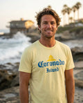 Person wearing Coronado Island T-Shirt in yellow at Windansea Beach in San Diego