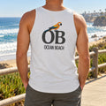 Back view of a white Ocean Beach tank top with a macaw on OB letters, worn on a boardwalk above the beach