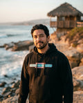 Person wearing Abnormal Heights Hoodie - Unisex at Windansea Beach in La Jolla in San Diego