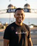 Person wearing Carlsbad Champion Parody T-Shirt at Carlsbad Village in San Diego