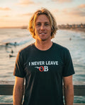 Person wearing I Never Leave OB T-Shirt at Ocean Beach Pier in San Diego