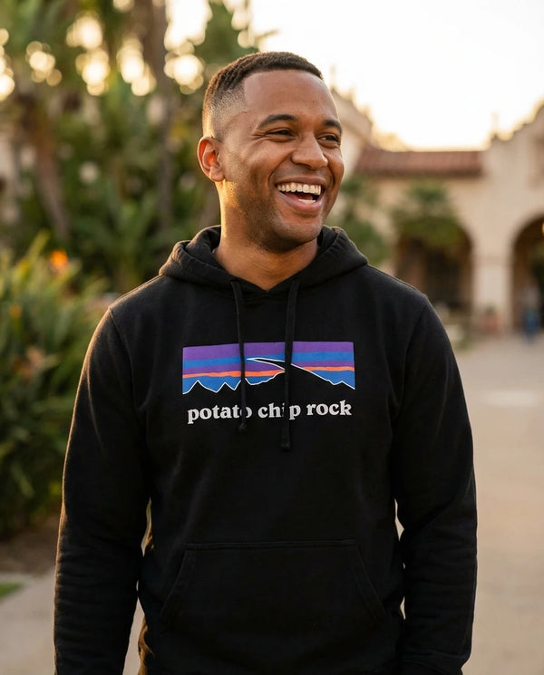 Person wearing Potato Chip Rock Hoodie - Unisex at Balboa Park in San Diego
