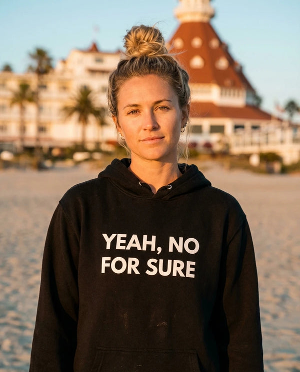 Person wearing Yeah No For Sure Hoodie - Unisex at Coronado Beach in San Diego